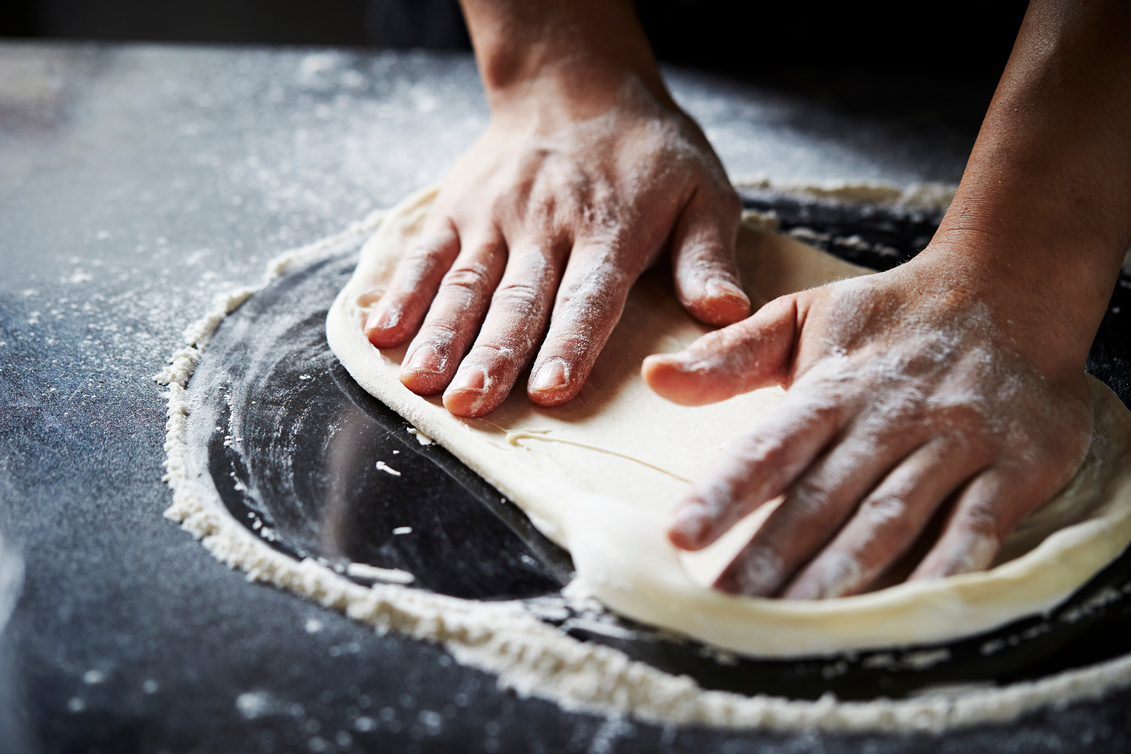 Kneading pizza dough